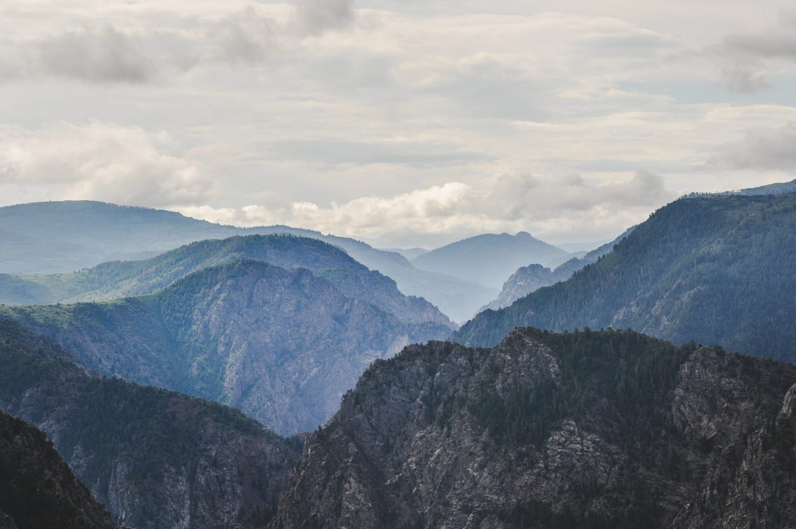Layered misty mountain ranges