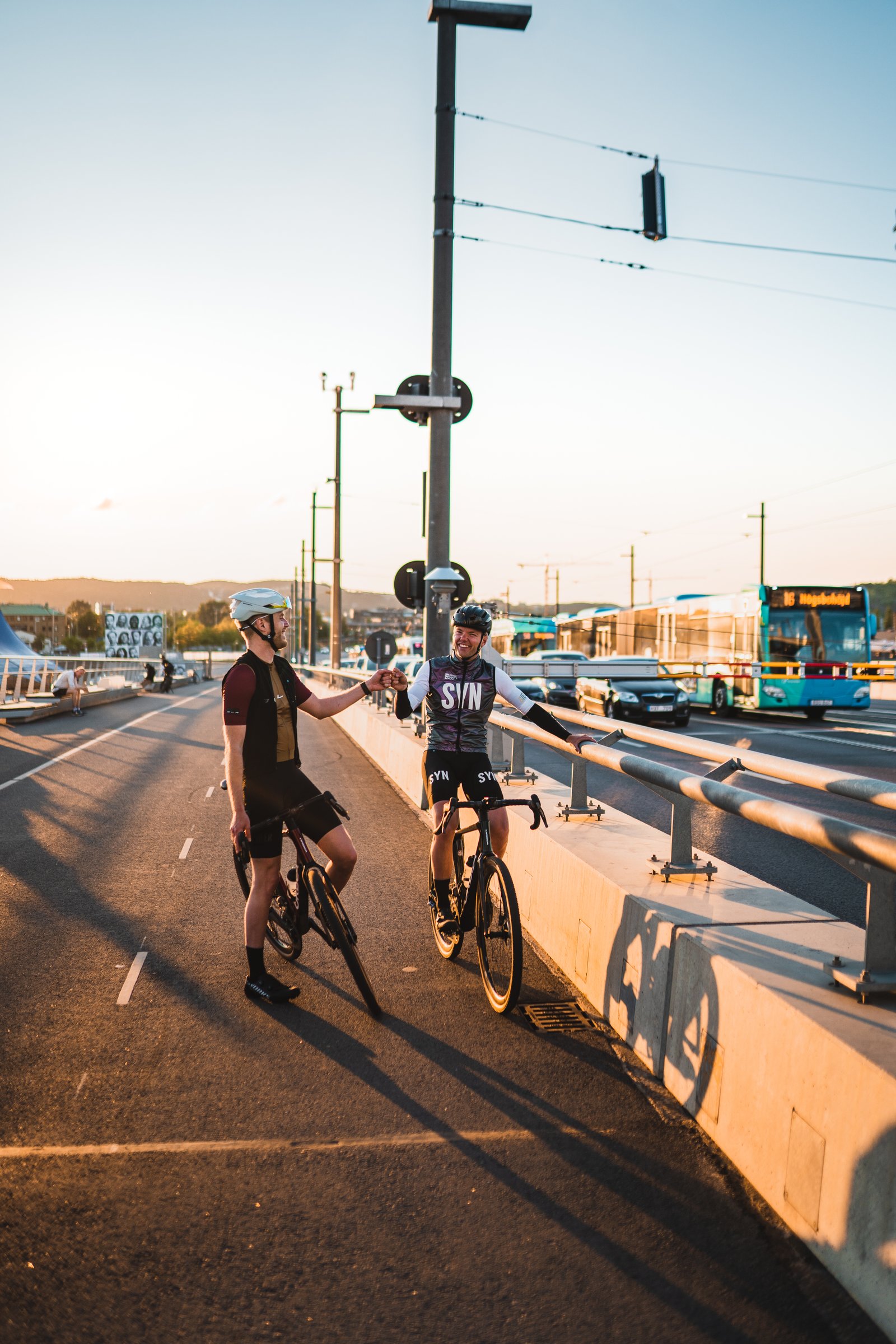 Johan and Dennis on a bridge over the water in Gothenburg at sunset