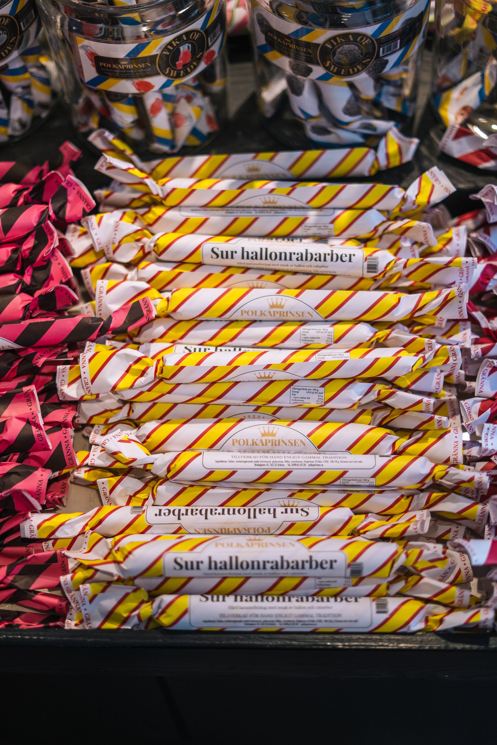 Stacked packets of striped polkagris candy