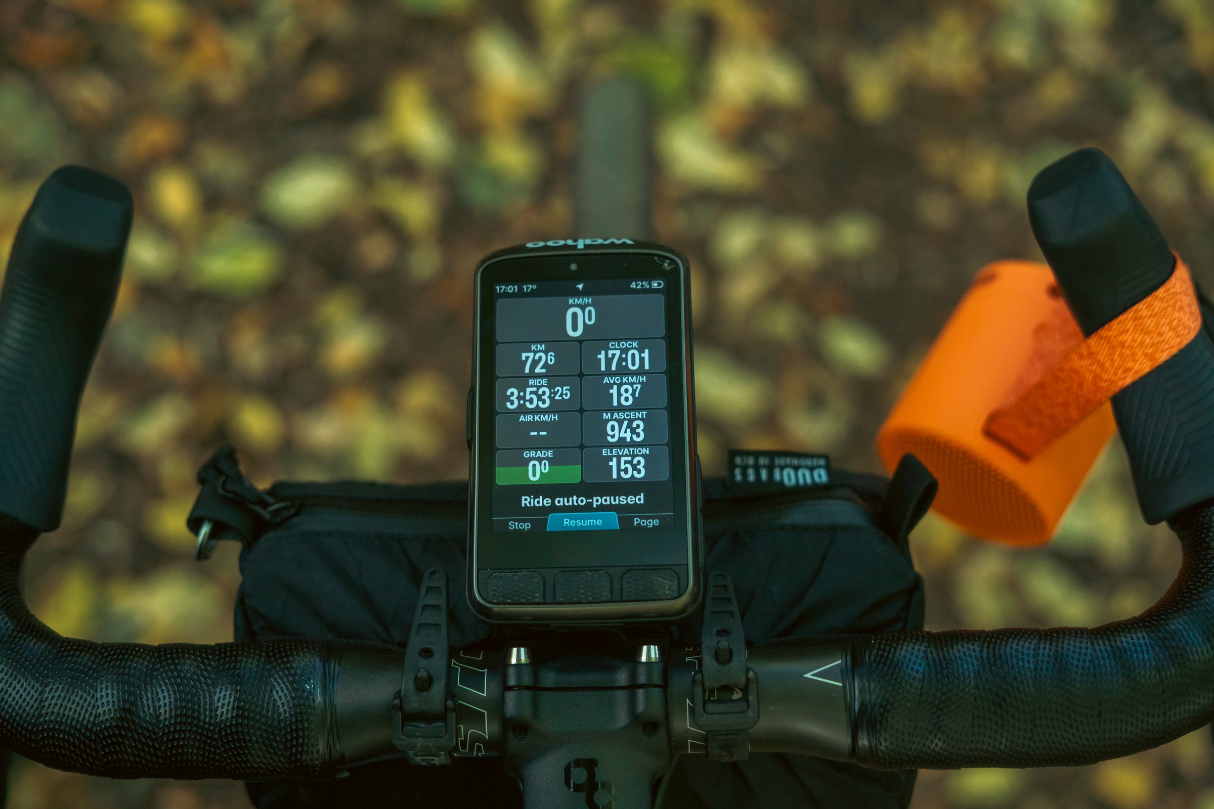 Bike computer on the handlebar showing the day's 943 metres of climbing